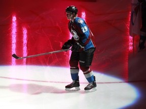 Colorado Avalanche rookie center Nathan MacKinnon is introduced before facing the Anaheim Ducks in an NHL hockey game in Denver, Wednesday, Oct. 2, 2013. MacKinnon, the top pick in the 2013 NHL Entry Draft, was playing in his first regualr season contest for the Avalanche. (AP Photo/David Zalubowski)