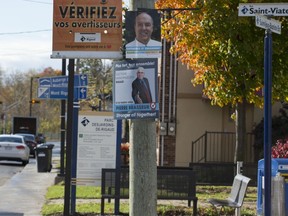 Campaign posters are seen along one of Rigaud's main streets.