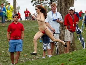 DUBLIN, OH - OCTOBER 06:  A streaker runs on the 18th hole during the Day Four Singles Matches at the Muirfield Village Golf Club on October 6, 2013  in Dublin, Ohio.  (Photo by Gregory Shamus/Getty Images)