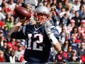 FOXBORO, MA - OCTOBER 27: Tom Brady #12 of the New England Patriots looks for an open man in the first half against the Miami Dolphins at Gillette Stadium on October 27, 2013 in Foxboro, Massachusetts. (Photo by Jim Rogash/Getty Images)