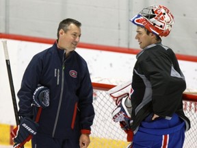 MONTREAL, QUE.: SEPTEMBER 19, 2013 -- Montreal Canadiens goalie Carey Price talks with goalie coach Stéphane Waite during practice at their training facility in Brossard, south of Montreal Thursday September 19, 2013.          (John Mahoney/THE GAZETTE)