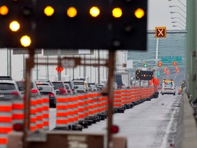 Long lines of heavy traffic bring the southbound Champlain bridge to a crawl as it is narrowed down to a single lane to allow repair crews to work on the bridge on Friday. The federal agency responsible for the span says it will use a "super beam" to brace a crumbling girder on the bridge, the most heavily traveled in Canada. (Allen McInnis / THE GAZETTE) ORG XMIT: 48588