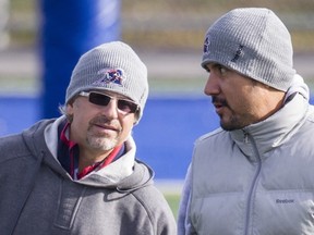 Als GM and coach Jim Popp (left) converses with injured QB Anthony Calvillo during Wednesday's practice.
Dario Ayala/The Gazette