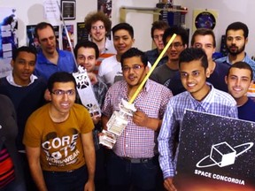 Mehdi Sabzalian, standing in the front row, second from left, poses with his teammates on the ConSat-2 project, Concordia University's second satellite construction project. (courtesy Space Concordia)