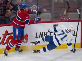Tampa Bay Lightning right wing Richard Panik, right, falls after colliding with Montreal Canadiens defenseman Douglas Murray, left, during the second period of their NHL hockey match in Montreal on Tuesday, November 12, 2013. (Dario Ayala / THE GAZETTE)
