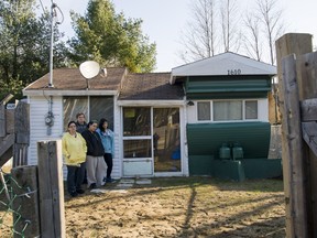 Allan Bassenden and Joni Malley, their daughter Natalie Gagnon and her daughter Bianca Gagnon outside their trailer in November 2013.