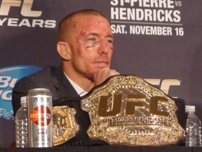 Welterweight champion Georges St-Pierre attends a post-fight news conference in Las Vegas, Nev., Saturday, Nov.16, 2013, after his UFC 157 win over Johny (Bigg Rigg) Hendricks. THE CANADIAN PRESS/Neil Davidson