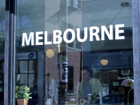 Co-owner Xavier Martinelli prepares a coffee inside Café Melbourne.