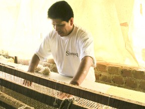 A Sumaq Rug worker at the loom in Peru.  (Photo courtesy of Sumaq Rugs)