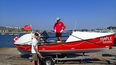 Jean-Guy Sauriol and Maple, the rowboat in which he will attempt to cross the Atlantic, east to west, starting Nov. 23, 2013.