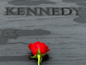 A rose left by family members sits on top of former U.S. President John F. Kennedy's grave marker at Arlington National Cemetery November 22, 2013 in Arlington, Virginia. Remembrance ceremonies will be held arcoss the United States today, the 50th anniversary of the assisination of President Kennedy.  (Photo by Chip Somodevilla/Getty Images)