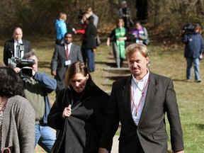 Rev. Frank Schaefer and his wife, Bridgett Schaefer, both of Lebanon, Pa., walk to lunch during a break in the penalty hearing at Camp Innabah, a United Methodist retreat, in Spring City, Pa., Tuesday, November 19, 2013. A jury of his pastoral peers “convicted” Schaefer on Monday of breaking his vows by officiating his gay son’s Massachusetts wedding in 2007. (AP Photo/Chris Knight)