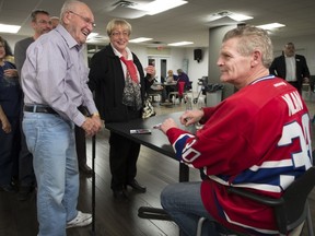 Residents of Le Cambridge seniors residence in Pointe Claire line up for autographs and to meet Nilan on Friday, Nov. 15.