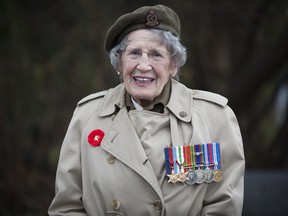 94 year old Maxine Bredt, who served in Italy and England as a Lt nursing sister, with her medals prior to walking in the  Remembrance Day parade in Hudson Quebec Sunday, November 10, 2013. (Peter McCabe / THE GAZETTE)