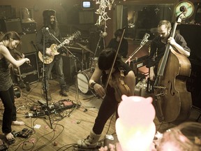 Members of Montreal's Thee Silver Mt Zion Orchestra rehearse in a scene from the documentary Come Worry With Us.