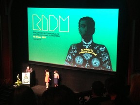 RIDM opening night ceremonies from my perch in the rafters of the Monument National. The tiny figures are, left to right, Mila Aung-Thwin, Charlotte Selb, and Roxanne Sayegh.