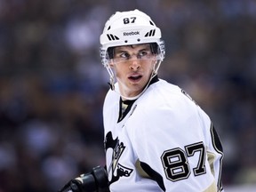 Pittsburgh Penguins captain Sidney Crosby looks up ice while playing against the Toronto Maple Leafs during third period NHL hockey action in Toronto on Saturday, Oct. 26, 2013. THE CANADIAN PRESS/Nathan Denette