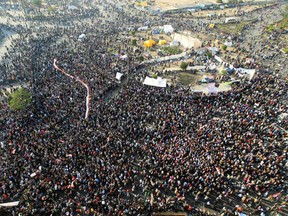 Thousands of Egyptians attend a rally in Tahrir Square on November 22, 2011, to demand an end to military rule. It was  the fourth day of clashes between protesters and riot police in the capital,  Cairo. (KHALED DESOUKI/AFP/Getty Images)