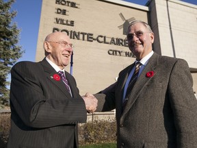 Former Pointe-Claire mayor Bill McMurchie, left, stands with newly elected mayor Morris Trudeau, outside city hall on  Monday ,Nov. 4.