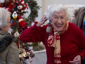 Iris Roegiers pretends to use a Christmas tree ornament as an earring while joking with Therese Gauthier, at the Hudson Christmas Craft Fair on Nov. 23, 2013.   The two-day fair at the Stephen F. Shaar Community Centre has been going on since the 1970's, and for 16 years at the centre.  (   )