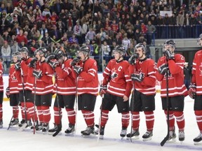Members of Team Canada react to their loss to Russia in bronze medal hockey action at the IIHF World Junior Championships in Ufa, Russia, on Saturday, Jan. 5, 2013. Russia beat Canada 6-5 in overtime to win the bronze medal. THE CANADIAN PRESS/Nathan Denette
