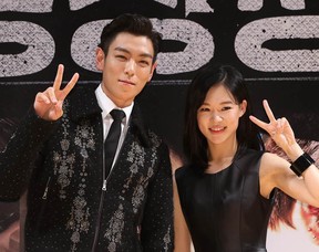 Choi Seung-Hyun (aka T.O.P.) and Kim Yoo-Jung, stars of South Korean film Commitment. 
(Starnews/AFP/Getty Images)