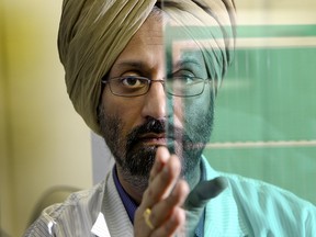 Raja Tuli, CTO of DataWind, a company that is the third-biggest tablet seller in India is holding a glass with a photoresist coating in a specialized lab in Montreal.