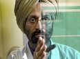 Raja Tuli, CTO of DataWind, a company that is the third-biggest tablet seller in India is holding a glass with a photoresist coating in a specialized lab in Montreal.