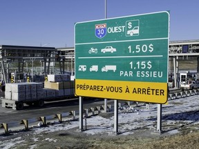 Traffic starts to flow on Highway 30 in Les Cedres, on Dec. 15, 2012, the highway's first day in operation.