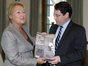 Premier Pauline Marois and Bernard Drainville hold a Charter of Quebec values when it was unveiled in September.