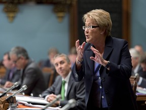 Quebec Premier Pauline Marois responds to Opposition questions on the deficit last week while Finance Minister Nicolas Marceau, behind, looks on. The opposition has threatened to bring down the government next spring over its lacklustre attempts to jumpstart Quebec's flagging economy. THE CANADIAN PRESS/Jacques Boissinot