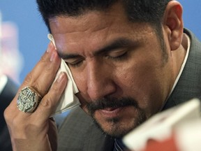 Als quarterback Anthony Calvillo wipes his eye while announcing his retirement Tuesday.
Ryan Remiorz/Canadian Press