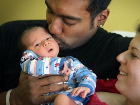 Stacy Andrade and Andrew Outar with their son Wesley at the Lakeshore General Hospital in Pointe Claire.