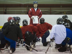 Peewee BB Lakeshore Panters coach Micheal Cloutier talks with players during practice.