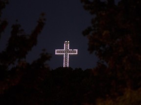 In this file photo from 2012, a cityscape view of Mount Royal and the cross is pictured in Montreal. The 30 meter high cross was erected in 1924 to commemorate January 6, 1643, when Maisonneuve, Montreal's co-founder, kept his promise to carry a wooden cross to the summit of Mount Royal. The cross is one of more than 6,000 Christian symbols and names that "clothe" Quebec society, hearings on Bill 60 were told.
(Allen McInnis/THE GAZETTE)