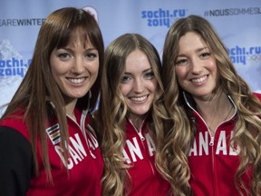 Sisters Maxime, Chloe and Justine Dufour-Lapointe, left to right, smile after being introduced as members of Canada's Olympic freestyle skiing team, Monday, January 20, 2014 in Montreal. THE CANADIAN PRESS/Paul Chiasson