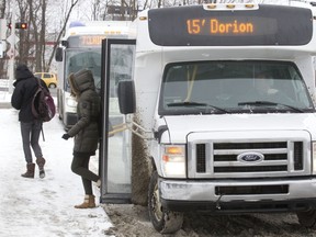 MONTREAL, QUE.: JANUARY 20, 2014 -- Commuters disembark from a CIT bus at the Vaudreuil Train station in Vaudreuil-Dorion, west of Montreal, Monday January 20, 2014.  (Phil Carpenter / THE GAZETTE)