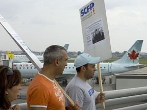 Air Canada workers picket during labour negotiations  in 2008. They seem happier these days, after the airline has erased a $3.7-billion pension fund deficit.