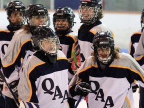 Players from Queen of Angels Academy ringette team.