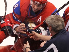 VANCOUVER, BC: FEBRUARY 24, 2010 -- Russia's Alex Ovechkin heads to the bench after injuring his hand during game against Canada in men's hockey game in Vancouver BC  Wednesday, February 24, 2010 during the 2010 Olympics.

(John Mahoney / Canwest News Service).


CNS-OLY-MHKY
