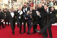 Actors from TV show Breaking Bad act goofy on the red carpet at the Screen Actors Guild Awards. Left to right:  Steven Michael Quezada, Dean Norris, Tait Fletcher, Michael Bowen, Lavell Crawford, Matthew T. Metzler, and Patrick Sane at the 20th Annual Screen Actors Guild Awards at The Shrine Auditorium on January 18, 2014 in Los Angeles, California.  (Frederick M. Brown/Getty Images)