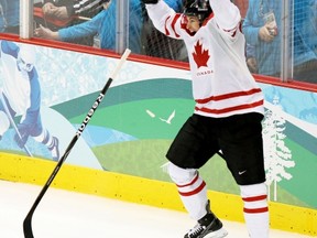 VANCOUVER, BC: FEBRUARY 28, 2010 -- Canada's Sidney Crosby thorws his stick away and starts to fling his gloves off while celebrating his game-winning overtime goal agains the USA during the gold medal men's hockey game in Vancouver, BC Sunday, February 28, 2010 during the 2010 Winter Olympics.  Crosby's glove and stick have gone missing.

(John Mahoney / Canwest News Service).


CNS-OLY-MHKY