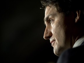 Liberal leader Justin Trudeau speaks about the Senate and Liberal senators during an announcement in the Foyer of the House of Commons on Parliament Hill in Ottawa. THE CANADIAN PRESS/Adrian Wyld