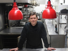 Chef Derek Bocking under the lights at Îcone.