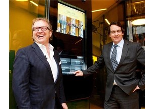 Quebecor top brass Robert Dépatie and Pierre-Karl Péladeau outside Videotron flagship store.