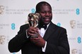 British director Steve McQueen poses with the award for best film for 12 Years A Slave at the BAFTA British Academy Film Awards at the Royal Opera House in London on February 16, 2014. (CARL COURT/AFP/Getty Images)