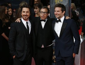 Actor Christian Bale (L), director David O. Russell (C) and  actor Bradley Cooper (R) arrive on the red carpet for the BAFTA British Academy Film Awards at the Royal Opera House in London on February 16, 2014. (ANDREW COWIE/AFP/Getty Images)