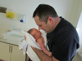 Larry Cantello with newborn Tobin, born Dec. 27, 2014