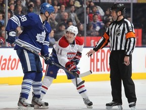 TORONTO, CANADA - APRIL 27:  Brendan Gallagher #11 of the Montreal Canadiens looks up at a menacing Frazer McLaren #38 of the Toronto Maple Leafs in a game against the Toronto Maple Leafs on April 27, 2013 at the Air Canada Centre in Toronto, Ontario, Canada. The Canadiens defeated the Leafs 4-1. (Photo by Claus Andersen/Getty Images)