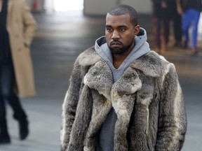 Kanye West arrives to attend Givenchy's Fall/Winter 2014-2015 men's fashion show in Paris on January 17, 2014.  (No photographers were permitted at his Bell Centre show Monday night, Feb. 17).